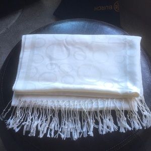 Cream colored scarf with circle pattern and fringed ends